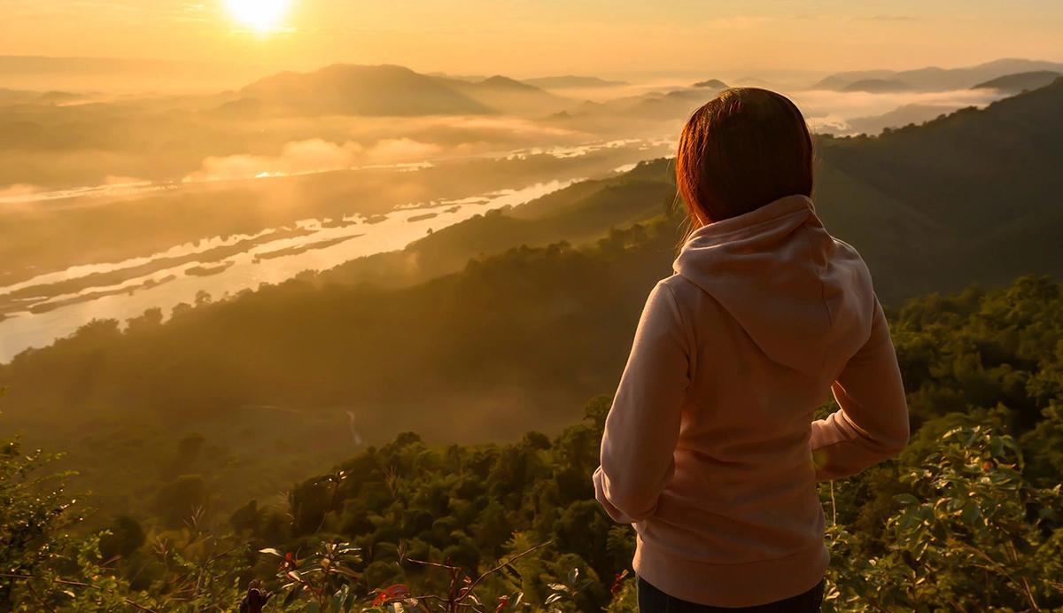 woman outdoors at sunrise