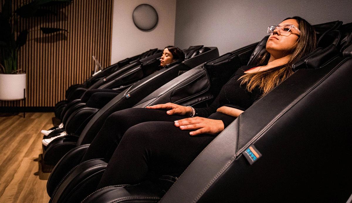 Woman sitting in a massage chair